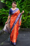 Orange Soft Raw Silk Saree With Bandhani Print & Weaving Border