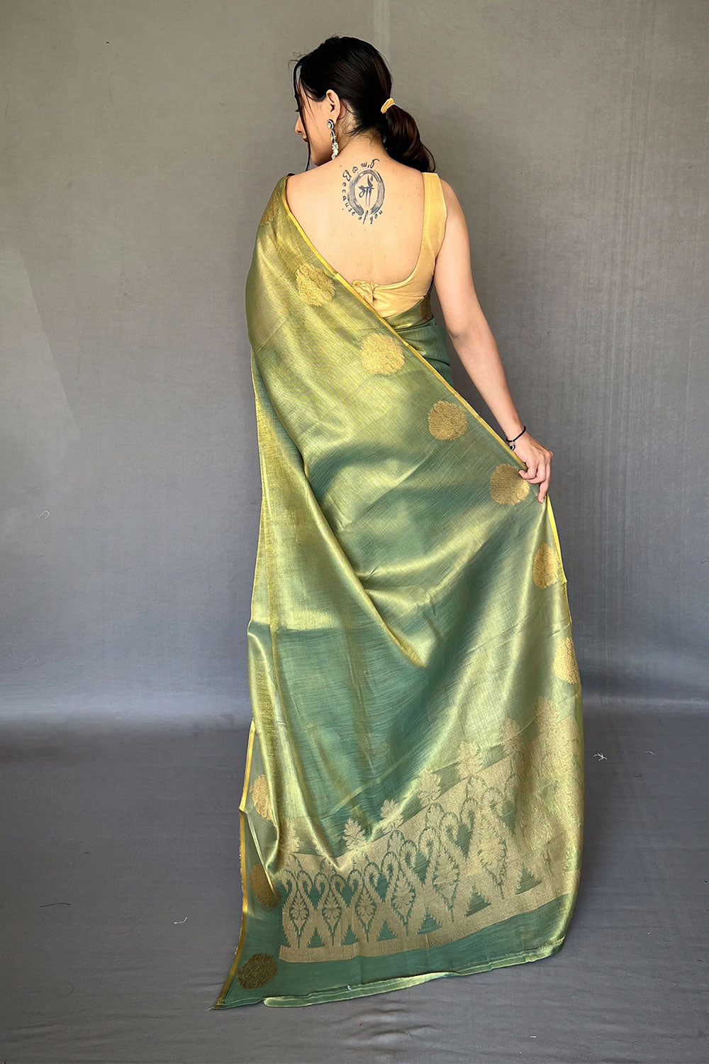 Ovile Green Tissue Silk Saree With Zari Weaving Work