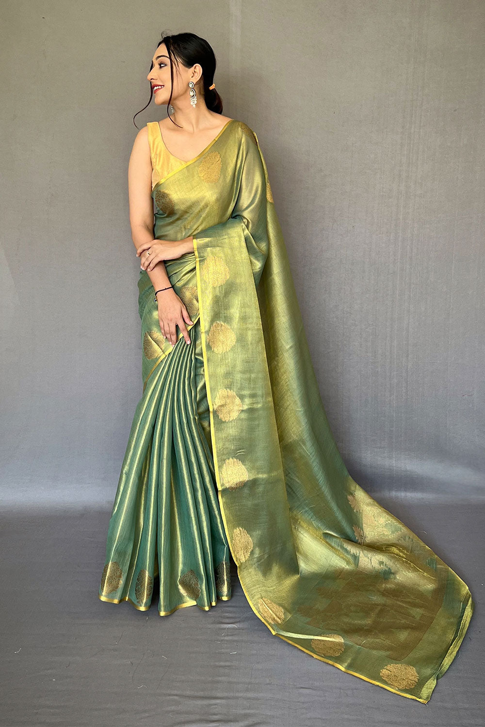 Ovile Green Tissue Silk Saree With Zari Weaving Work