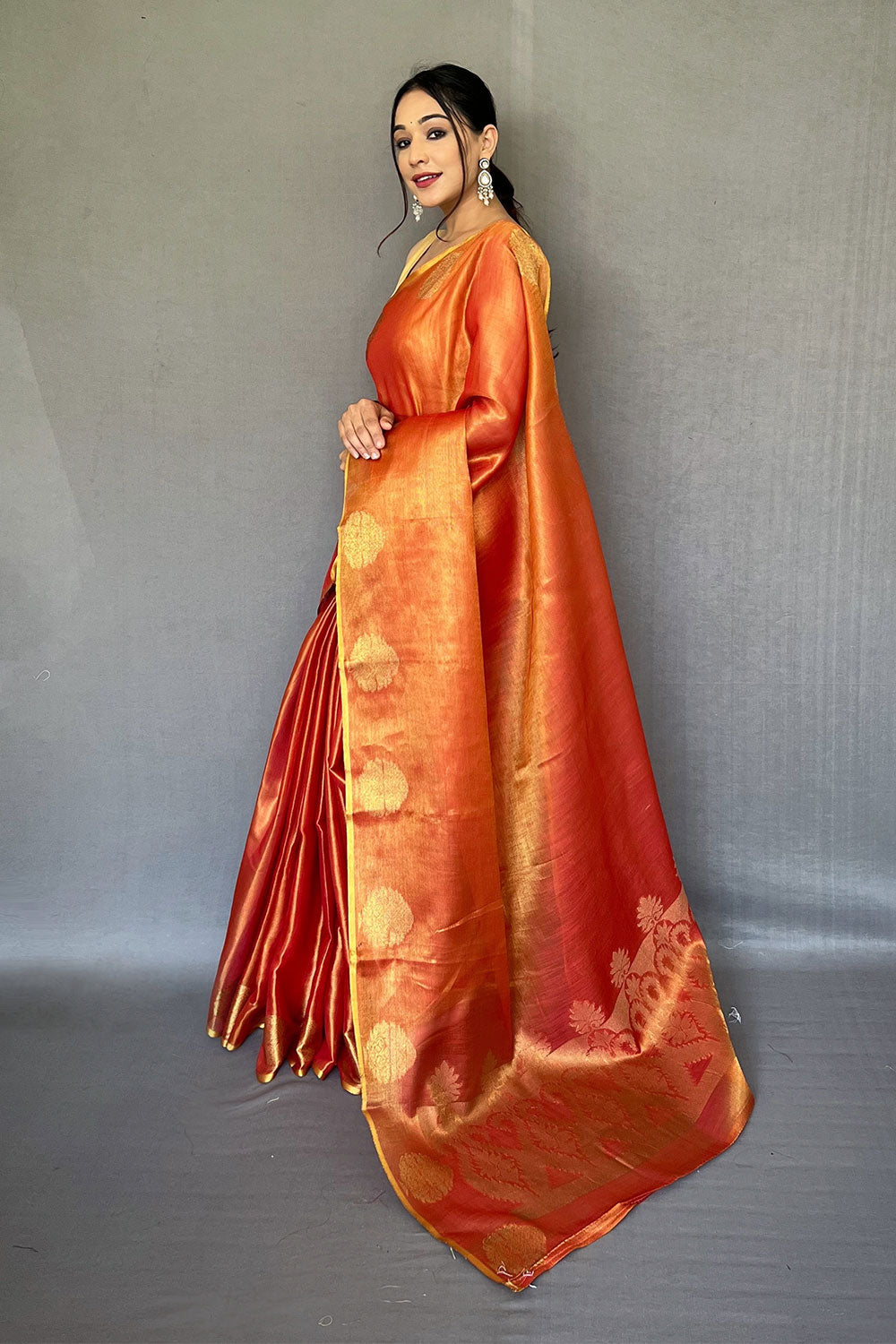 Light Orange Tissue Silk Saree With Zari Weaving Work