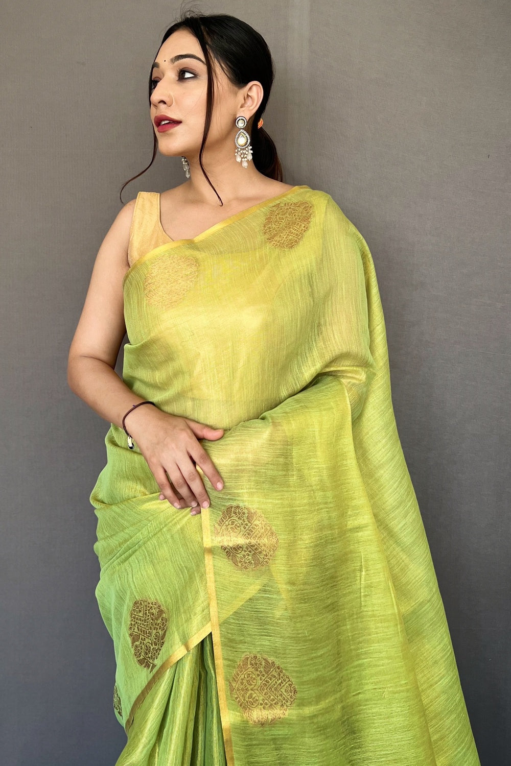 Parrot Green Tissue Silk Saree With Zari Weaving Work