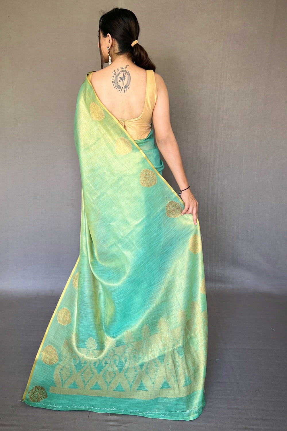 Rama Green Tissue Silk Saree With Zari Weaving Work
