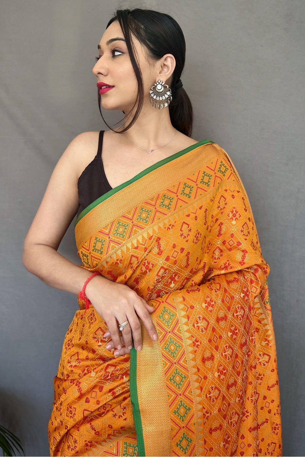 Yellow Patola Silk Saree With Zari Weaving Work