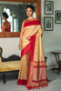 Cream Semi Tussar Silk With Ikkat Weaves Checks Fancy Tassels Saree