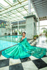 Teal Green Semi Tussar Silk With Ikkat Weaves Checks Fancy Tassels Saree