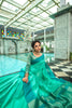 Teal Green Semi Tussar Silk With Ikkat Weaves Checks Fancy Tassels Saree
