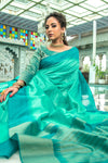 Teal Green Semi Tussar Silk With Ikkat Weaves Checks Fancy Tassels Saree
