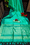 Teal Green Semi Tussar Silk With Ikkat Weaves Checks Fancy Tassels Saree