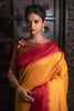 Yellow Semi Tussar Silk With Ikkat Weaves Checks Fancy Tassels Saree