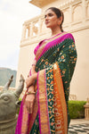 Alluring Green  And Pink Patola Silk Saree
