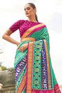 Alluring Green And Pink Patola Silk Saree