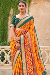 Alluring Orange And Green Patola Silk Saree