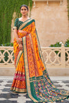 Alluring Orange And Green Patola Silk Saree
