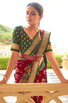 Alluring Maroon And Green Patola Silk Saree