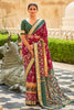 Alluring Maroon And Green Patola Silk Saree