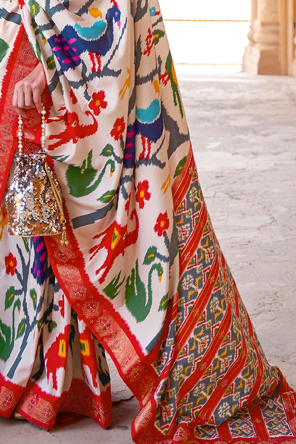 Extravagant White Woven Patola Silk Saree With Classic Border