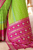 Charming Optic Green Woven Patola Silk Saree with Classic Border