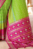 Charming Optic Green Woven Patola Silk Saree with Classic Border