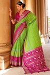 Charming Optic Green Woven Patola Silk Saree with Classic Border