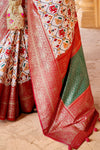 Luxuriant Off-White Woven Patola Silk Saree with Classic Border