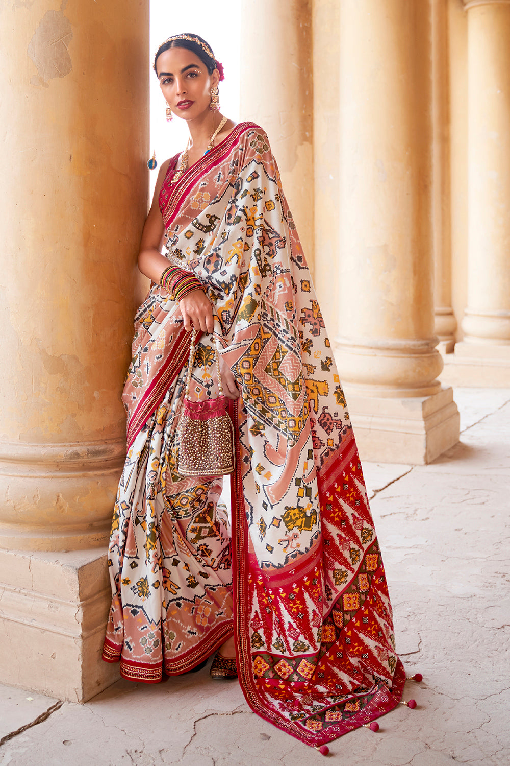 Innovative Off-white Woven Patola Silk Saree with Classic Border